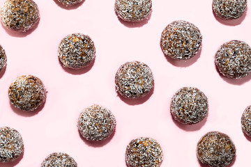 Pattern made of energy balls with oat and coconut.