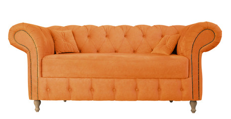 Orange sofa with pillows on wooden legs isolated on white. Orange suede couch isolated