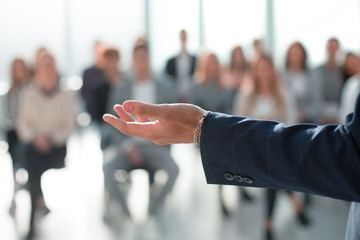 background image of a speaker making a report for a working group