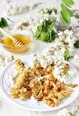 flowers of white acacia in batter. organic food from nature. natural habitat. Edible flowers. foraging
