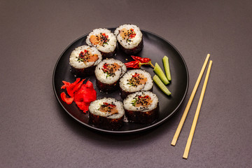 Korean roll Gimbap(kimbob). Steamed white rice (bap) and various other ingredients. Trendy black background