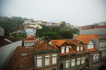 Obraz premium Residential buildings in foggy weather, in Porto, Portugal.