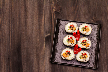 Korean roll Gimbap(kimbob). Steamed white rice (bap) and various other ingredients. Trendy black background