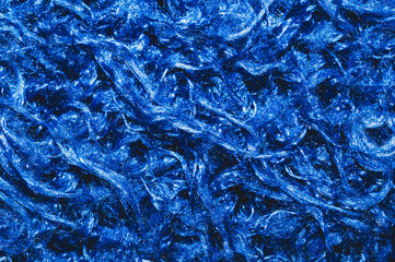 Soft fabric texture. blue textile with curly fibers. wool background