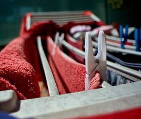 clothespins holding clothes on a string