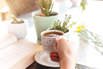 Warm and comfortable reading books and drinking coffee at home. having a good time at home
