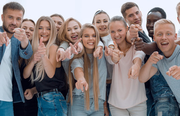 group of young like-minded people pointing at you