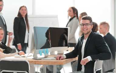 image of a successful business man sitting at his Desk