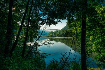 This is an offshoot of Bluestone Lake captured with fog hanging over the mountain in the distance,...