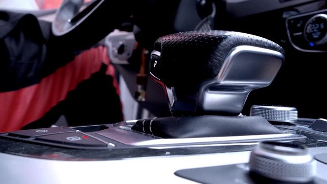 Automatic transmission, automatic gear shift, is moved from P (Park) to D (Drive) and back. Car start, starting a modern car.