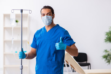 Young male doctor working in the clinic