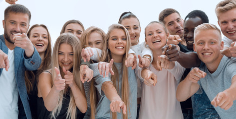 group of young like-minded people pointing at you