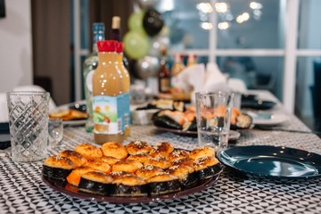 Japanese baked sushi rolls food. Rolls in a dish on the festive table