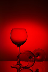 Wine glasses composition on red.