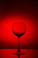 Wine glasses composition on red.