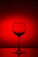 Wine glasses composition on red.