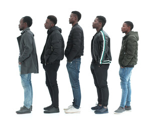 Obraz premium group of diverse guys standing in turns . isolated on white