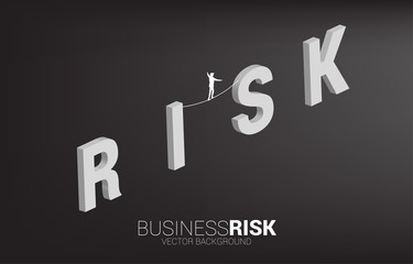 Silhouette of businessman walking on rope walk way on risk wording.Concept for business risk and challenge in career path
