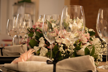 Elegant table setting with flowers and white and black dinnerware