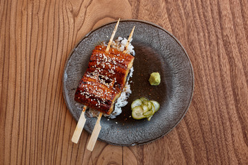 Fried unagi eel with barbecue sauce shot from above