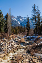 Fototapeta premium Cascades on a clear creek in a park East Kootenay british columbia.