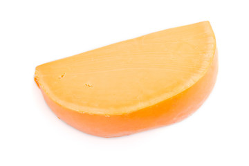 Piece of orange cheese isolated on white background. Top view.