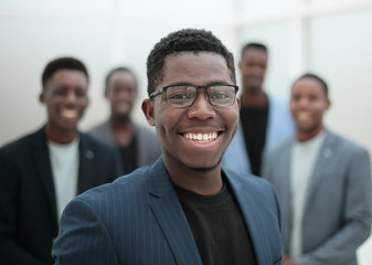 young businessman pointing to his business team