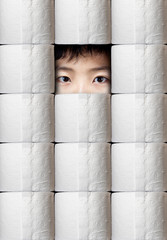 Hoarding During Pandemic With Person Peering Through Toilet Paper