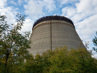 Unfinished cooling tower in Chernobyl zone at afternoon, fall season, abandoned building of Chernobyl nuclear power plant, Ukraine