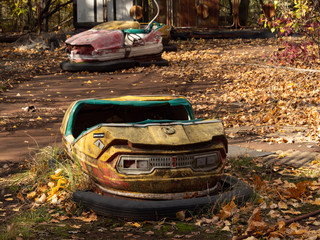 Bumper cars in abandoned amusement park in Pripyat, Chernobyl Exclusion Zone in autumn. Ukraine