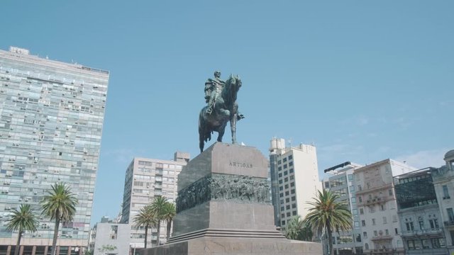 Camera track right view orbit around Artigas Statue in Plaza Independencia of Montevideo, Uruguay