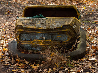 Bumper car in abandoned amusement park in Pripyat, Chernobyl Exclusion Zone in autumn. Ukraine