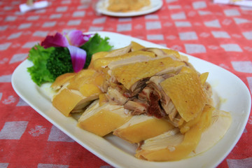 Close up shot of a plate of steamed brown chicken