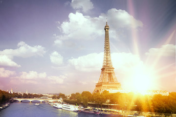 Fototapeta na wymiar Romantic sunset background. Eiffel Tower with boats on Seine river in Paris, France.