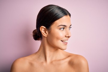 Close up of young beautiful woman with clear and pure skin. Perfect and clean skincare wearing...