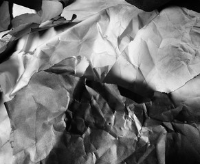background of fragments of crumpled paper, black and white