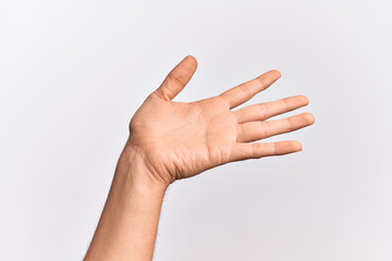 Hand of caucasian young man showing fingers over isolated white background presenting with open palm, reaching for support and help, assistance gesture