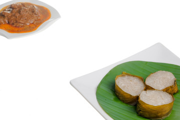 Lemang  and Rendang isolated on white background. Popular food for breaking fast during ramadan, Ramadan Food.