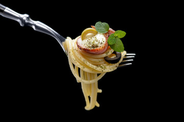 Spaghetti with bacon on fork