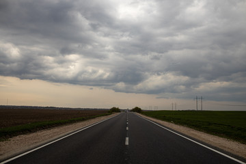 The stormy clouds on sunset  Highway