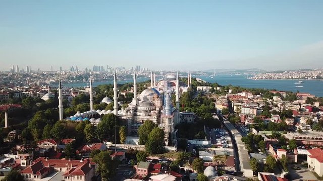 Cinematic Aerial View of Blue Mosque, Istanbul Downtown in Skyline and Bosphorus on Evening Sunlight