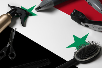 Syria flag with hair cutting tools. Combs, scissors and hairdressing tools in a beauty salon...