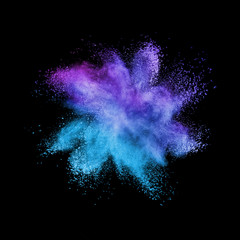 Abstract multicolored powder splash on a black background.