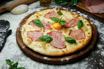 Italian pizza with egg bacon and cheese