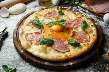 Italian pizza with egg bacon and cheese