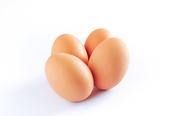 Four brown chicken egg isolated on white background