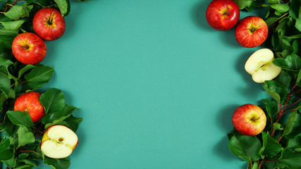 Healthy food with fresh red apples and leaves creative concept flatlay with negative copy space on...