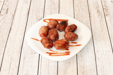 grilled sausage dish with barbecue sauce