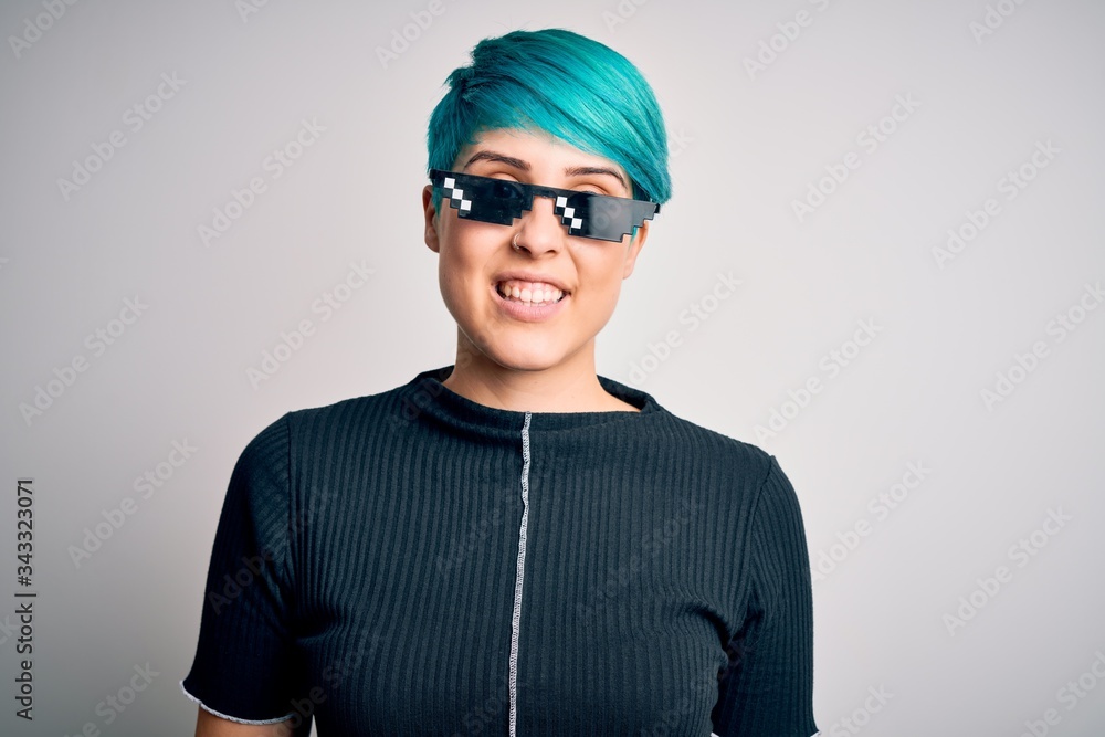 Sticker young woman with blue fashion hair wearing thug life sunglasses over white background with a happy a