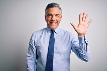 Middle age handsome grey-haired business man wearing elegant shirt and tie showing and pointing up...